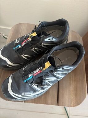 Salomon Men’s Black Trail Sneakers with Yellow & Blue Accents